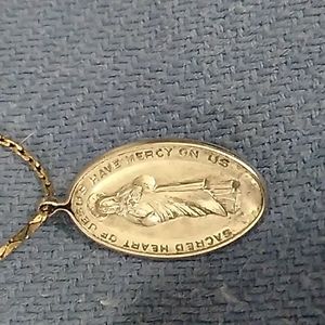 Silver sacred heart medallion